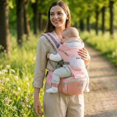 porte bebe rose avec bebe en promenade